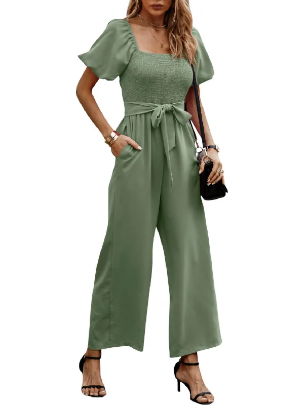 Modern Glamour Smocked Wide Leg Jumpsuit In Green